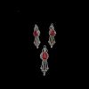 Complete jewelry set including a matching ruby pendant and drop earrings with a chandelier design and teardrop diamond accents.