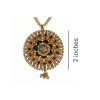 A close-up of a 2-inch circular antique gold-finished mandala pendant featuring intricate filigree, black enamel accents, and amber-colored glass stones on a crystal bead chain.
