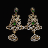 A pair of intricate gold-finish chandelier earrings featuring teardrop emerald green stones and surrounded by small white sparkling diamonds on a black background.