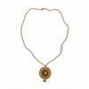 Full view of a vintage-style gold medallion necklace with a long translucent beaded chain and a dangling crystal charm at the bottom.