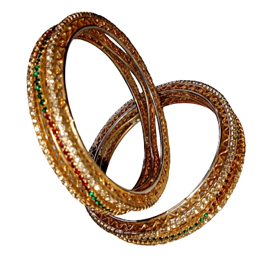 A pair of intricate gold-toned Indian-style bangles interlocking against a white background. The jewelry features a textured, filigree design with a central row of small, sparkling white stones, interspersed with vibrant green emerald-colored and deep red ruby-colored accents.