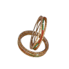 A pair of gold-plated bangles set against a plain white background. The bangles feature intricate filigree metalwork and are embellished with small, shimmering white crystals alongside alternating rows of emerald green and ruby red gemstones.