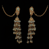 A pair of gold-toned Jhumka earrings displayed against a solid black background. The earrings feature sea-green beaded studs, a bell-shaped centerpiece, and multiple cascading chains adorned with tiny white beads and gold droplets. Long "Sahara" ear chains extend from the studs.