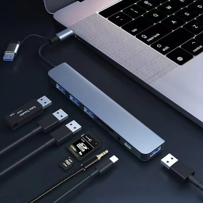 7-in-1 Multi-port USB-C and USB 3.0 dual connector hub featuring aluminum body, SD/TF card slots, and audio jack.7-in-1 Multi-port USB-C and USB 3.0 dual connector hub featuring aluminum body, SD/TF card slots, and audio jack.